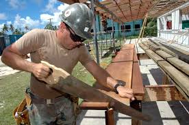 Carpenter sawing wood