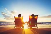 Couple watching sunset at the beach